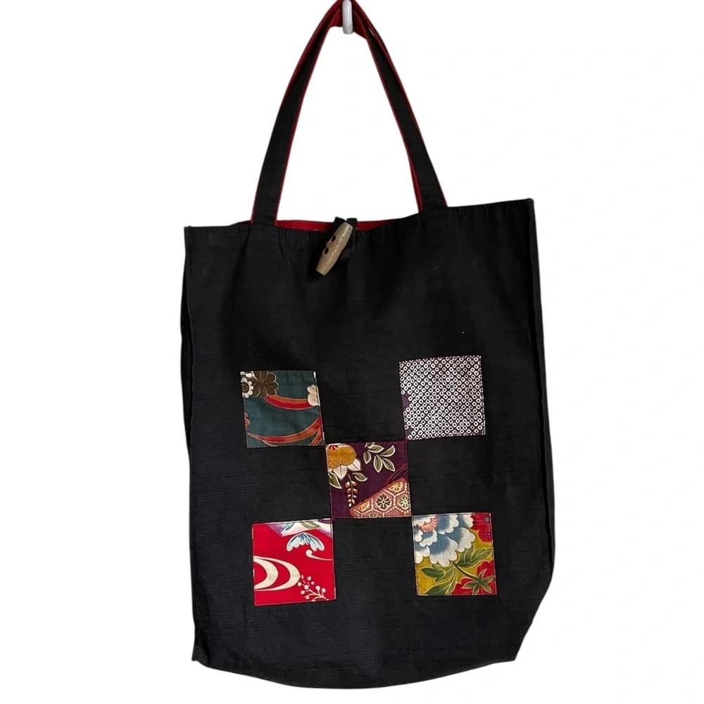 Vintage Cotton patchwork tote bag with a red lining and a toggle closure